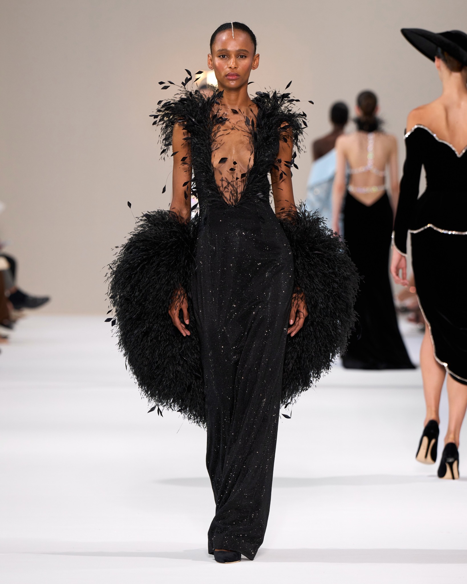 Tamara Ralph black feathered couture look on the runway